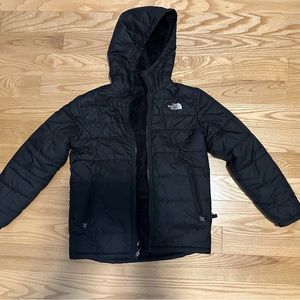 Kids Northface reversible puffer/fuzzy jacket. Black, size M (10/12)